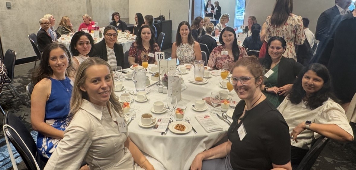 People seated at a round table for breakfast