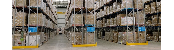 Pallets wrapped and stocked on shelves in a warehouse